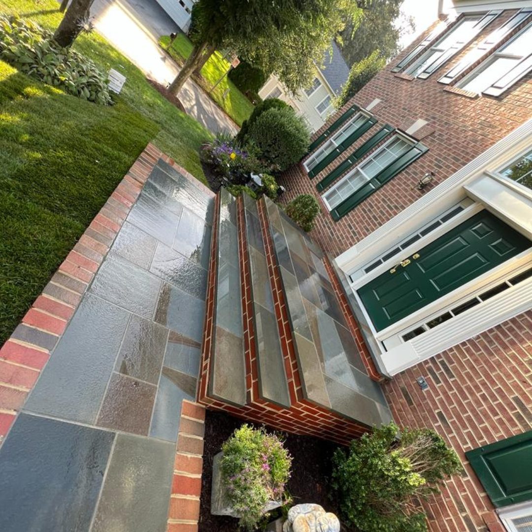 Stone steps and walkway leading to a house entrance.