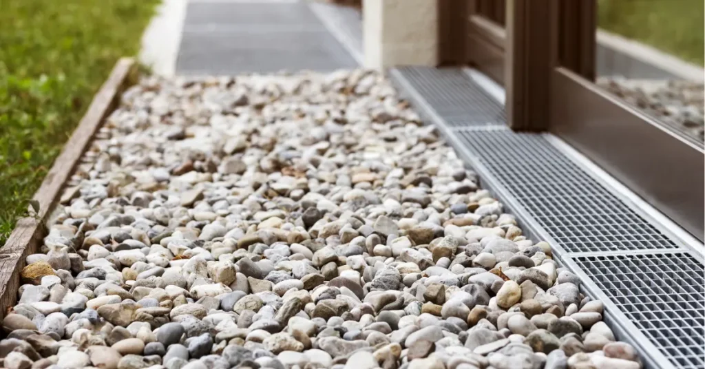 Different types of drainage systems including gravel and grate options for residential water management solutions