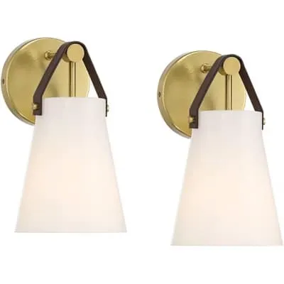 Two gold wall sconces with white conical shades and dark accent handles.