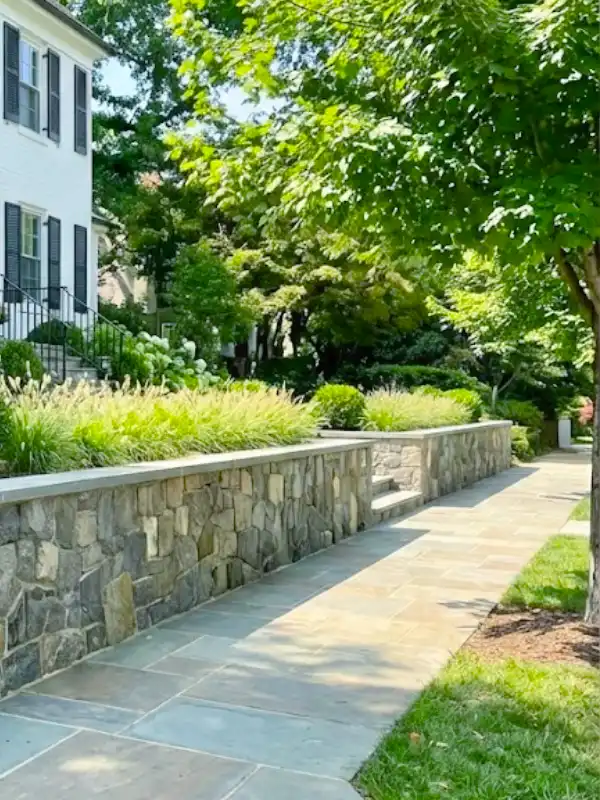 Flagstone walkway and stone retaining wall by hardscape contractors in Palisades, DC, near Potomac River