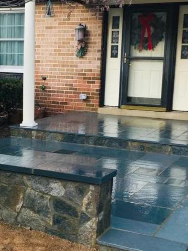 Full color thermal flagstone, sitting wall with foggy bottom veneer, & flagstone caps in Annapolis, MD, by Blue Collar Scholars.