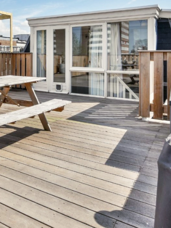 Professional deck builders installing a custom wood deck for a home in Columbia, Maryland