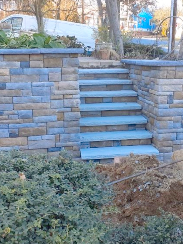Properly installed retaining wall in Chevy Chase, MD, using EP Henry Blocks with new Staircase.