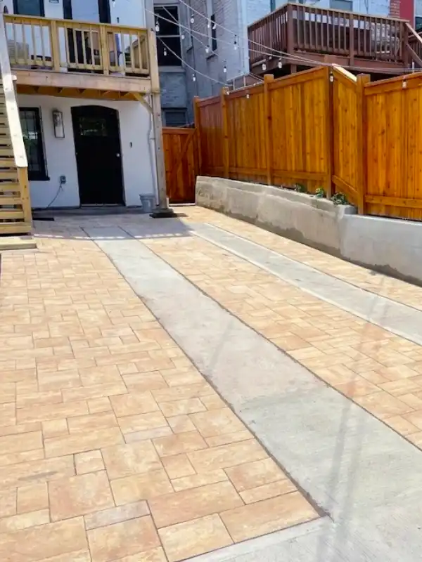 Washington DC row home driveway upgrade. Driveway constructed using Nicolock pavers, CR6, stone dust, and concrete by Blue Collar Scholars