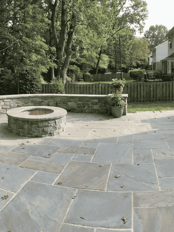 Flagstone patio featuring a fire pit on a Great Falls, VA property