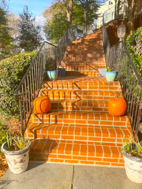 Brick staircase and iron railings crafted by hardscape contractors in McLean, VA.
