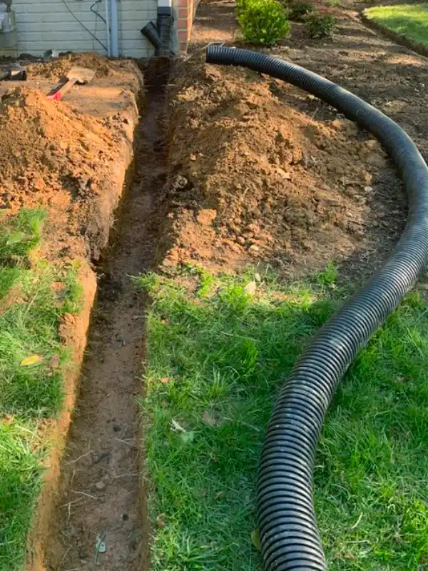 Buried downspout extension before installation in the DMV area.