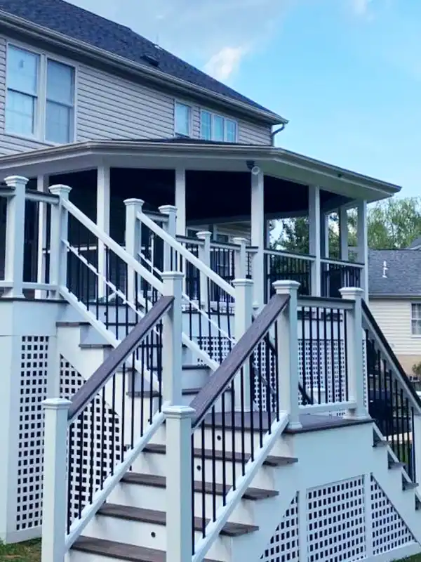 Finished white screened-in porch addition with stairs in the DMV Area.