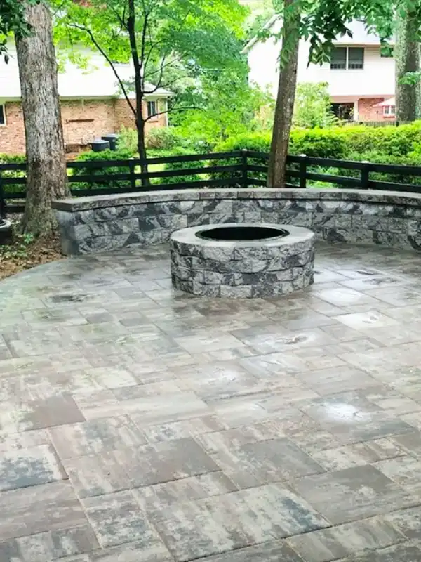 Stone fire pit installation by hardscape contractors in the DMV area