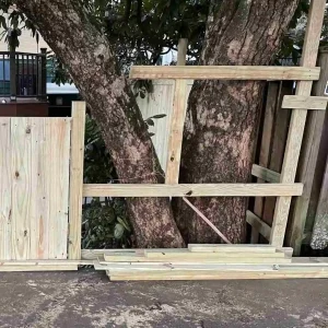 custom fence installation to avoid cutting the tree