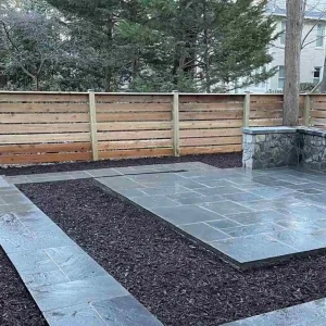 defined area by using a fence, walkway, mulch, and patio
