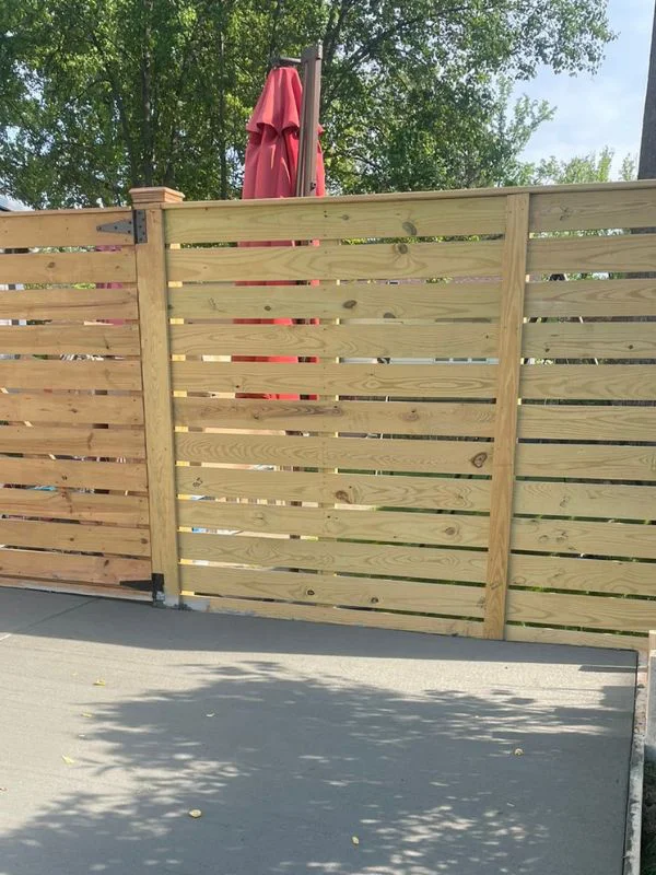 wooden fence with concrete patio