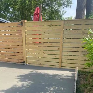wooden fence paired with a concrete patio