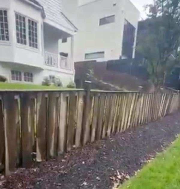 Existing old timber retaining wall and backyard slope before construction in Bethesda MD