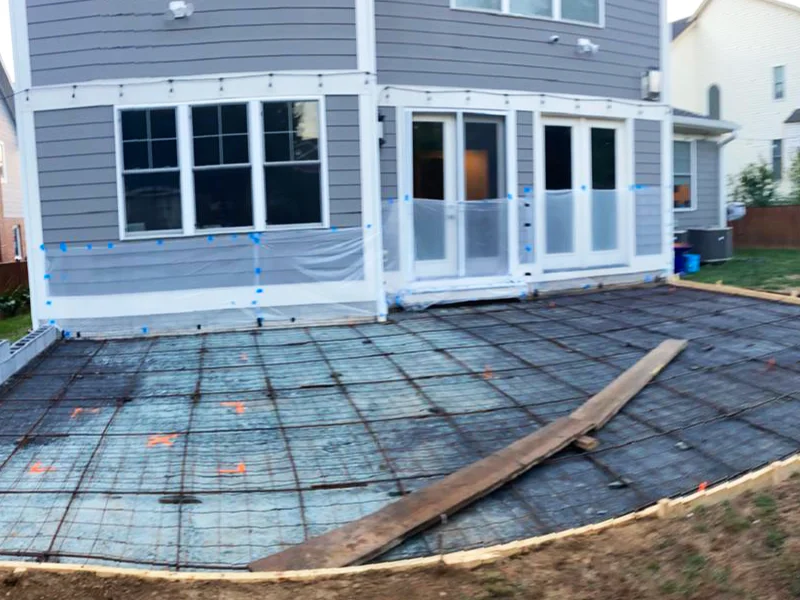 Finished concrete sub-base with forms stripped and pad ready for flagstone