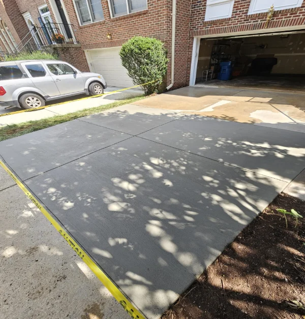 side view of the completed concrete driveway replacement