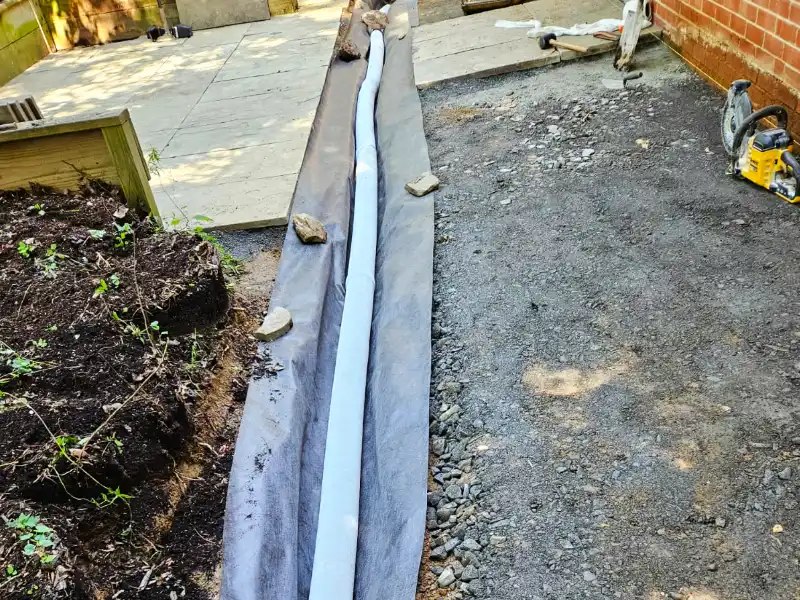 french drain system installed under patio and walkway