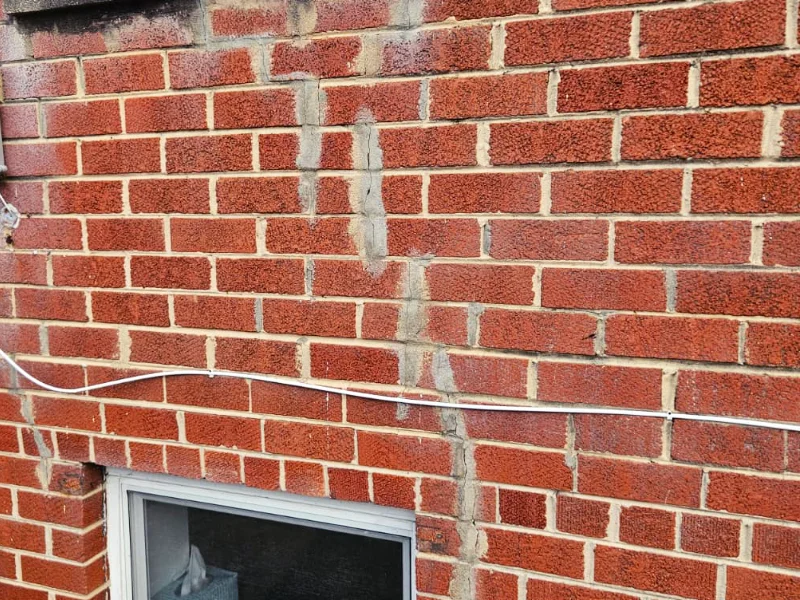 Mortar joints being patched and filled during brick repair in Temple Hills, MD