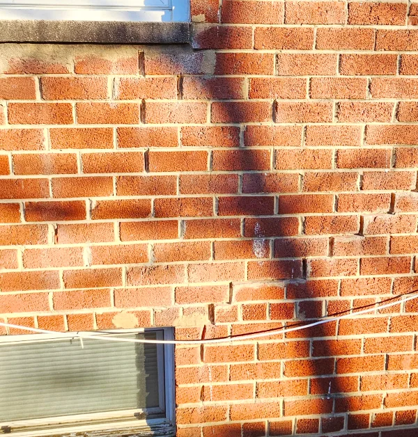 Repaired exterior mortar joints on red brick home in Temple Hills, MD