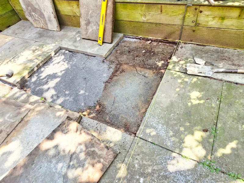 removing the originial flagstone to realign it