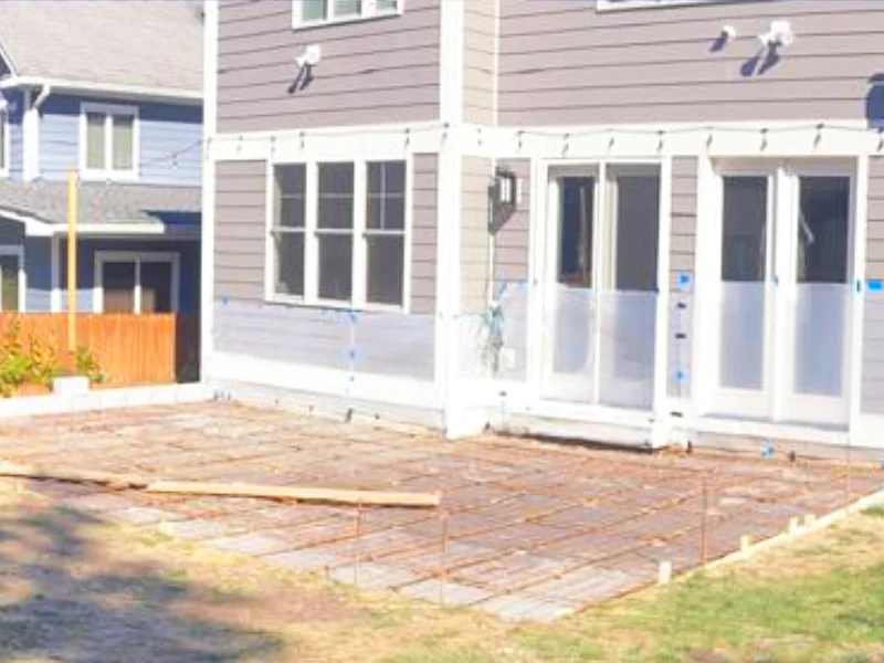 Rebar grid and wooden forms set for reinforced concrete patio sub-base