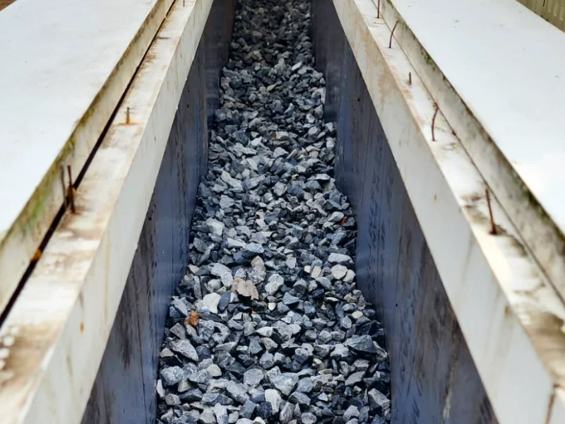 Gravel drainage layer installed in front entry planter area