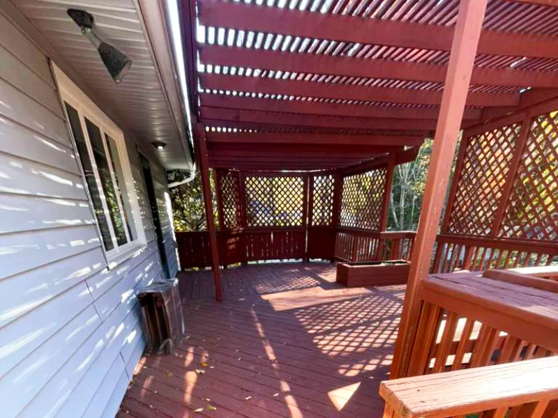 Inside view of the red wooden deck and pergola