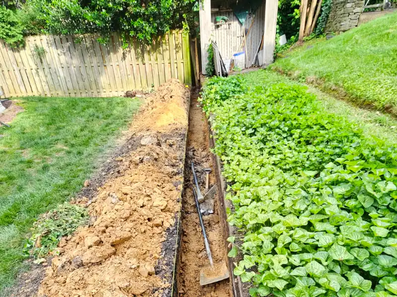 Retaining wall trench with rebar and string line in Bethesda MD