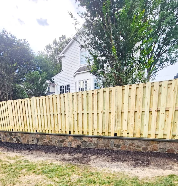 Completed retaining wall and privacy fence installation in Bethesda MD backyard