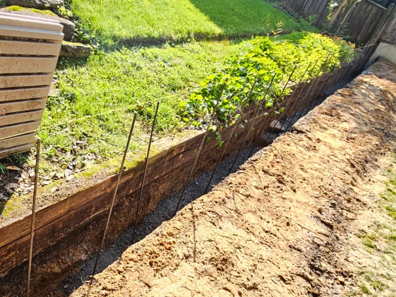 Retaining wall trench excavation along rear property line in Bethesda MD
