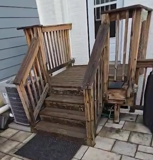 Existing pressure-treated wood deck before demolition, showing the smaller original footprint prior to the backyard renovation.