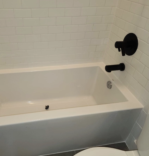 completed the leveling and recaulking of the bathtub in