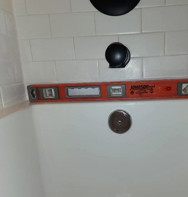 completely leveled bathtub with new caulk seal