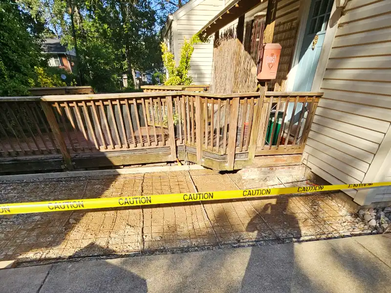 Driveway reconstruction area prepared with compacted stone base and wire mesh reinforcement