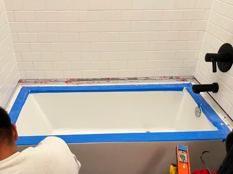 releveling the bathtub by adding the shims