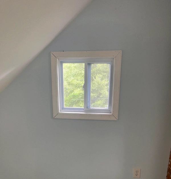 Original attic window before replacement in a historic Kensington home prior to installing a code-compliant casement egress window.