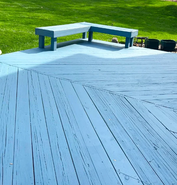 Freshly painted wood deck with built-in benches after deck refinishing in Silver Spring, MD.