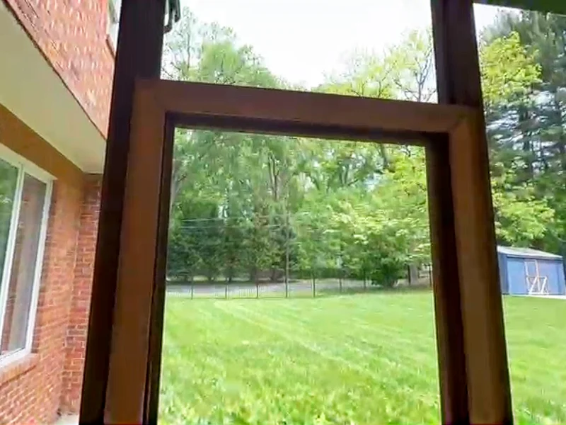 Existing wood porch framing before PVC wrapping, showing exposed posts and beams prior to the screened porch enclosure.